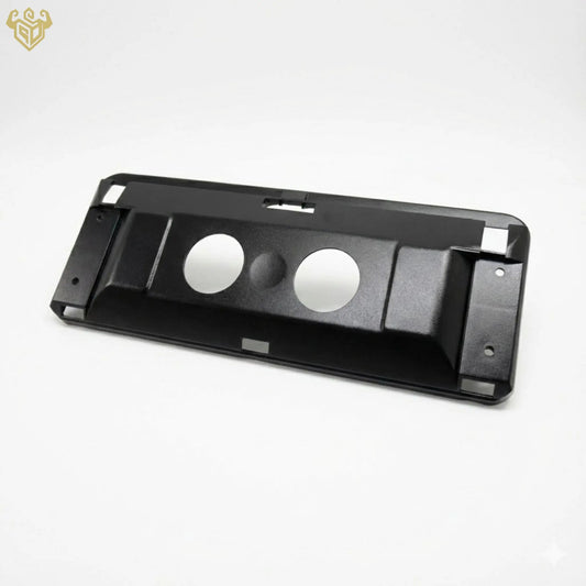 The backing plate being snapped into place on a Mercedes sun visor.