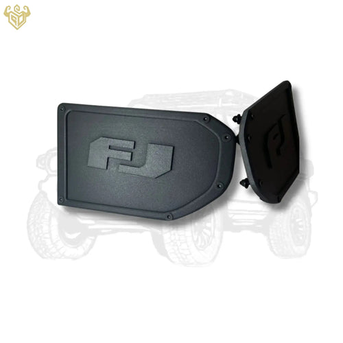 Two matte-black FJ corner caps posed together, engraved logos clearly visible.
