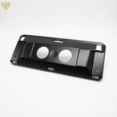 The backing plate being snapped into place on a Mercedes sun visor.