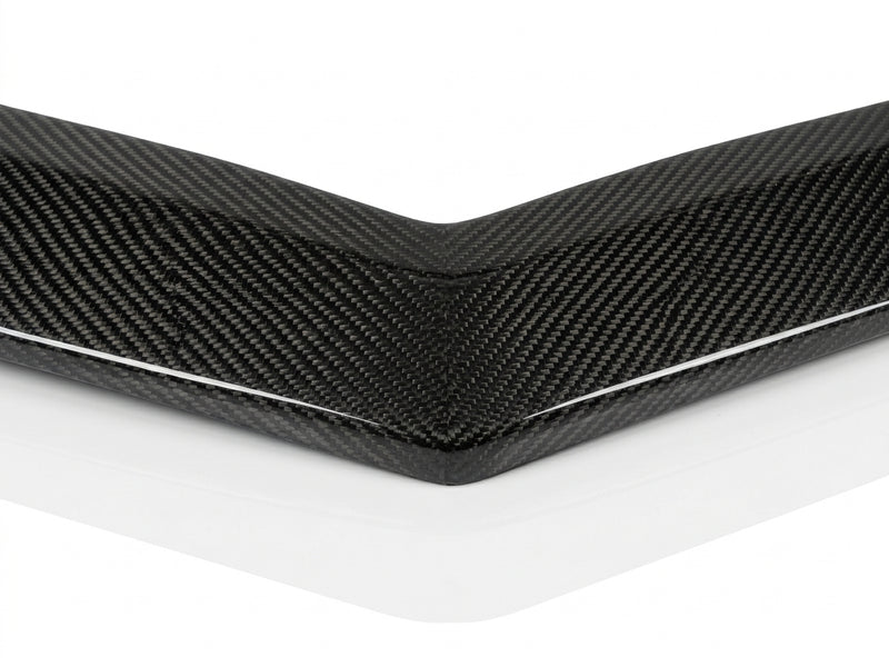 Close-up of the twill carbon fiber weave and gloss clear coat on the C63 Black Series front lip