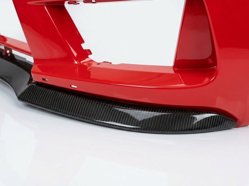 Close-up of the carbon fiber lip end plate under a C63 AMG Black Series bumper corner