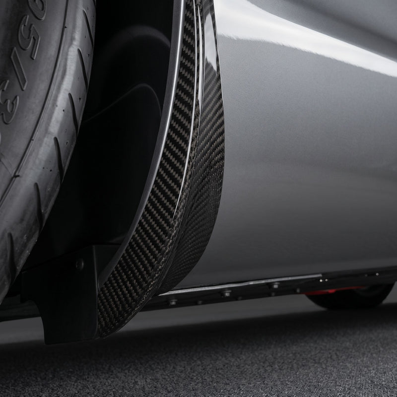 Close detail of the right-hand carbon rear spoiler fitted to an SLR McLaren 722, showing the woven carbon surface